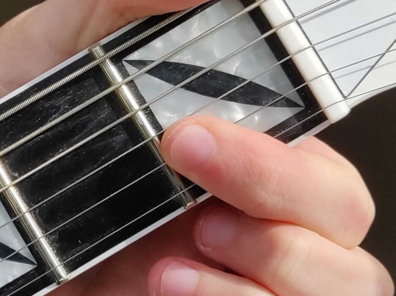 How to bar multiple notes down at once for playing chords.