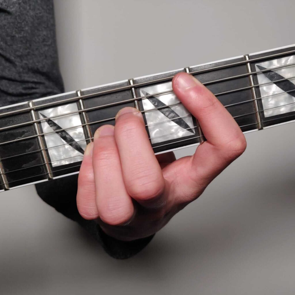 B bar chord - A shape fingering