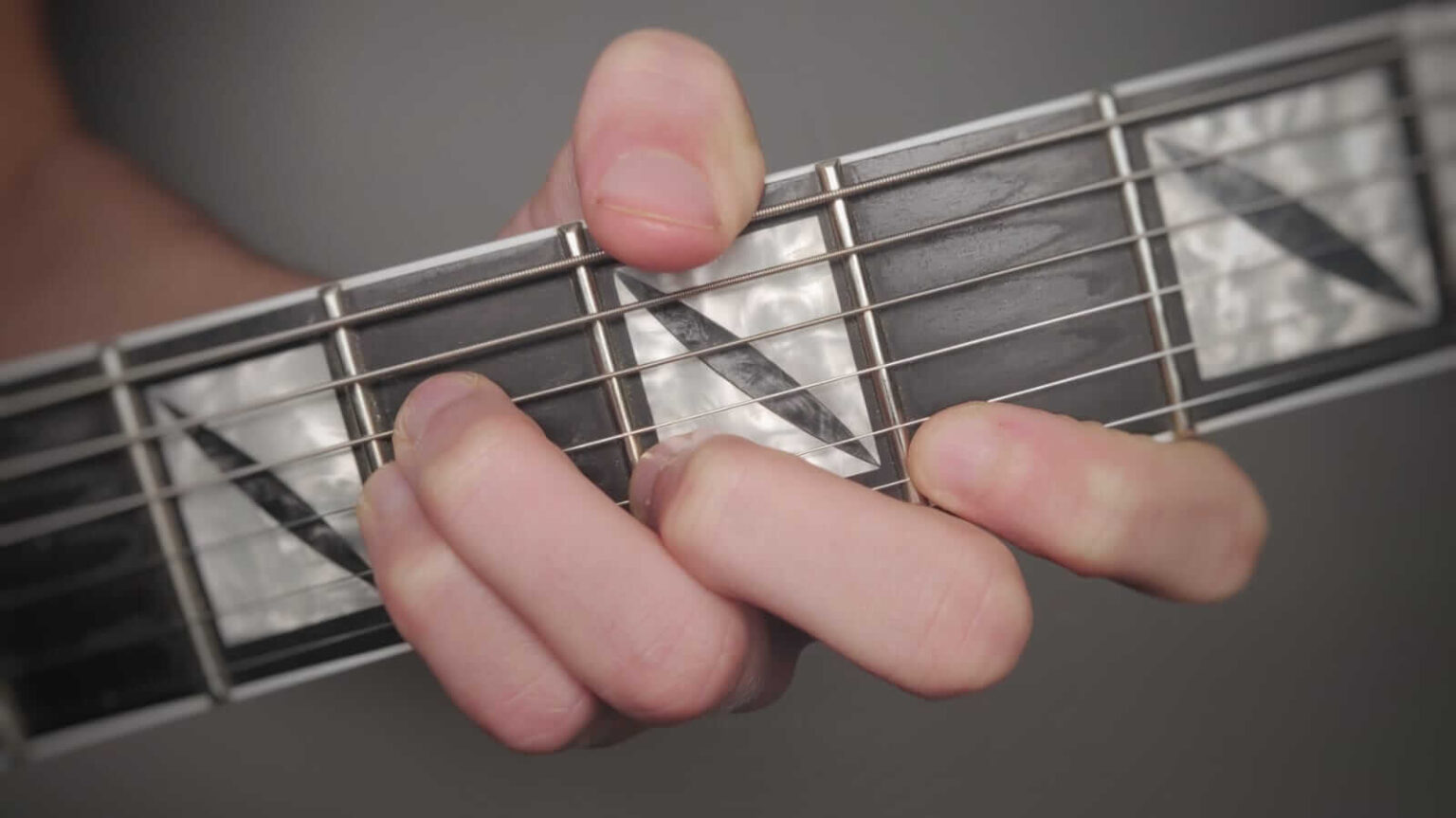 7 Easy Ways to Play a B Minor Chord on Guitar - Beast Mode Guitar