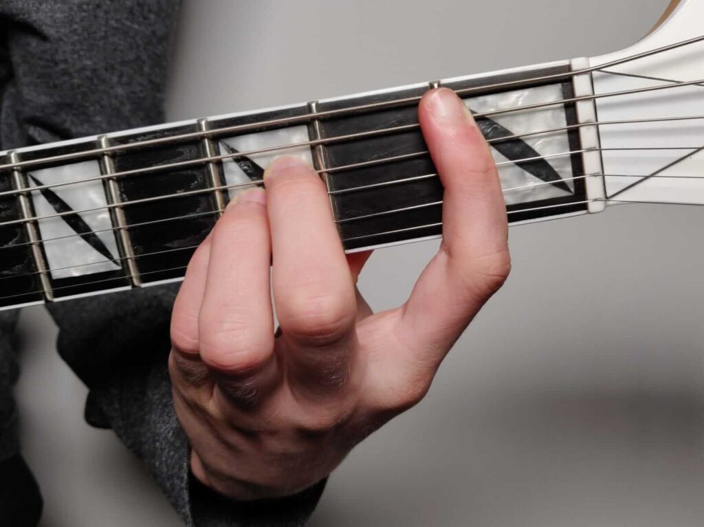 B flat (Bb) A shape bar chord fingering
